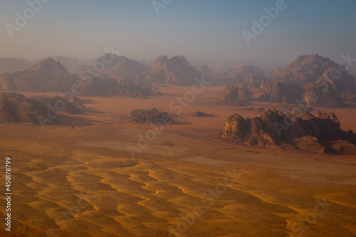 The view of rock formations in Wadi Rum desert from a hot air balloon at sunrise, Jordan, April 2018