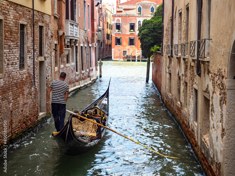 Gondolier in a Venice canal close-up
