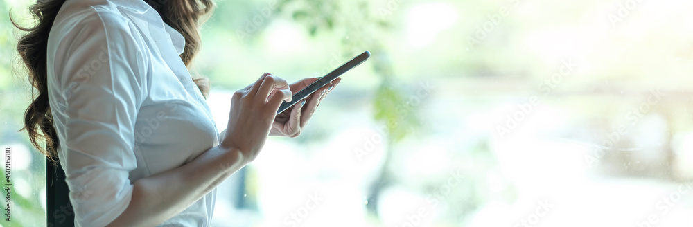 Close up hand of woman using smartphone, texting text message, hipster touch screen on smartphone light bokeh, girls using in hands cellphone close up, online internet.