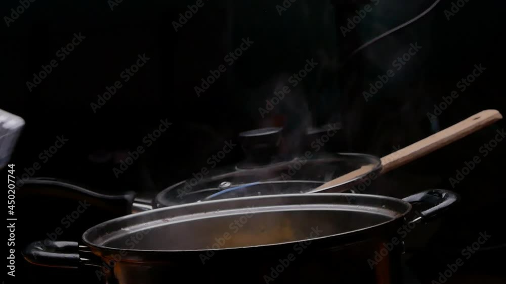 Cassava is being boiled in a pot of boiling water to making Thai dessert, Cassava root with coconut milk or Singkong Rebus, traditional Indonesian food. Cassava is being boiled in a pot of boiling water to making Thai dessert, Cassava root with coconut milk or Singkong Rebus, traditional Indonesian food.