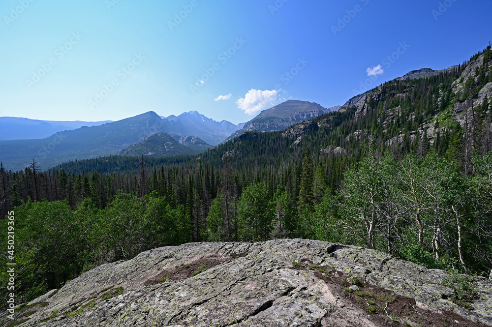 View of mountains from Emerald Lake Trail in Rocky Mountain National Park, Colorado on sunny summer morning. View of mountains from Emerald Lake Trail in Rocky Mountain National Park, Colorado on sunny summer morning.