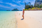 A lonely traveler on the Poda island shores in Thailand