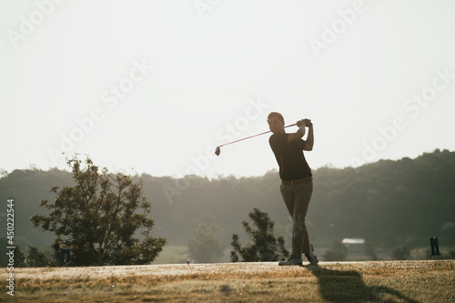 Golfers take the swing shot with a strong stance.