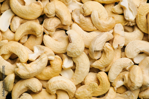 Top view raw cashew nuts rotation, close up.