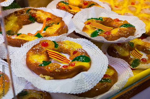 Delicious tortell - ring shaped brioche decorated with sugared fruit and traditionally eaten in Catalonia during celebration of Epiphany. High quality photo photo