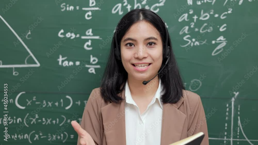 Young asian teacher woman teaching speak to camera video conference with student. Female teacher training the mathematics in classroom blackboard online course. Young asian teacher woman teaching speak to camera video conference with student. Female teacher training the mathematics in classroom blackboard online course.