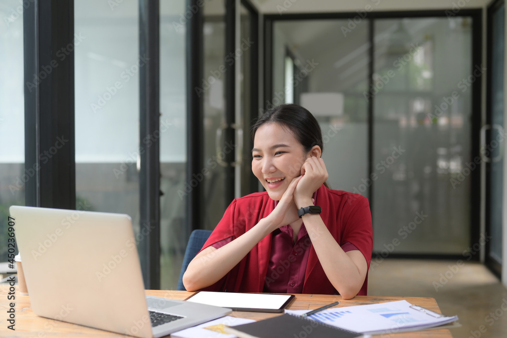 Happy businesswoman having video call with her friends with laptop. Happy businesswoman having video call with her friends with laptop.