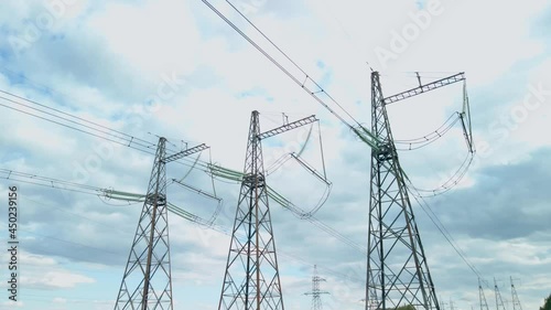 Survey of high-voltage power lines by a quadrocopter. High Voltage Electricity Transmission Pylon.Power Lines Supply With Wire.High Voltage Electric Tower With Insulators.