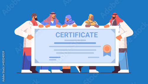 arab graduated doctors holding certificate arabic graduates celebrating academic diploma degree university medical education