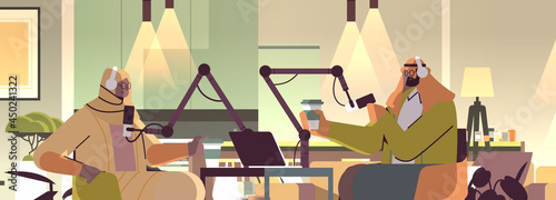 arab podcasters talking to microphones recording podcast in studio podcasting online radio broadcasting concept