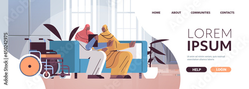 friendly nurse or volunteer supporting arab elderly woman home care services healthcare and social support concept