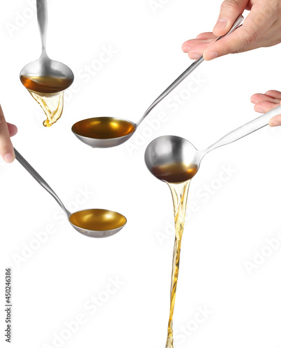 Dipper pouring noodle soup on white background, Soup for sukiyaki from chicken and fish