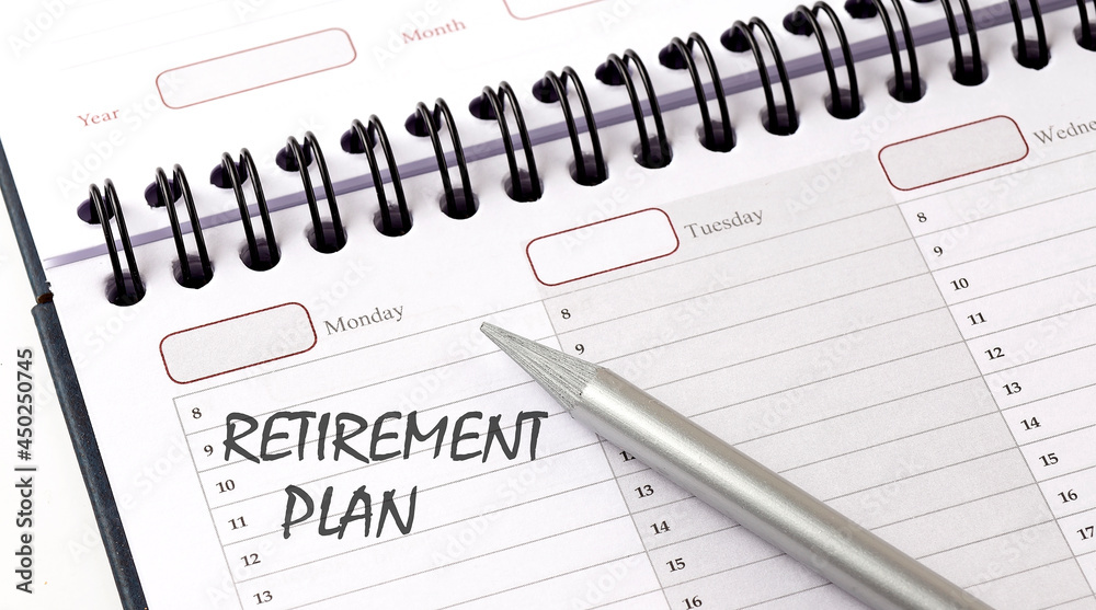 RETIREMENT PLAN on the planner with pencil, business concept RETIREMENT PLAN on the planner with pencil, business concept