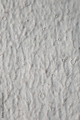 Painted white wall background with bubbles and creases