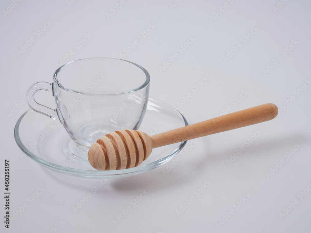Honey pot and ladle isolated on a white background as a packaging design element Honey pot and ladle isolated on a white background as a packaging design element