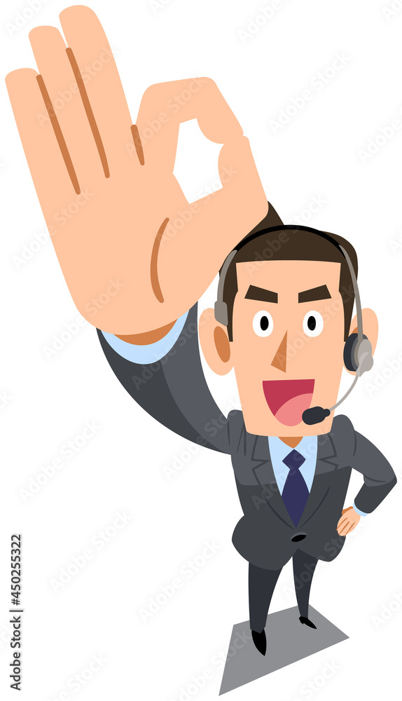 手でOKのサインを示すヘッドセットを装着したスーツ着用の男性
