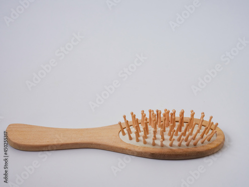 Single wooden massage brush  comb isolated on white background
