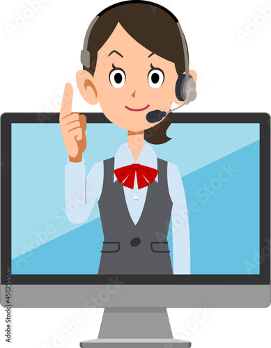 ヘッドセットマイクを着用しオンラインで説明する制服の女性とデスクトップモニター

