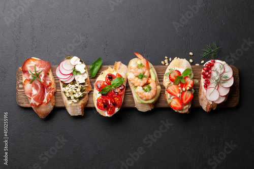 Appetizers board with traditional spanish tapas set. Italian antipasti snacks