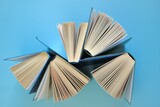Knowledge and education.Books on a blue background.Reading of books.Knowledge and Learning Concept.Book pages close-up.Reading concept. High quality photo