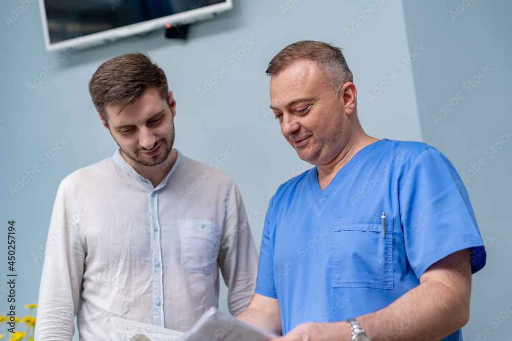 Medical worker explaining the results. Doctor discussing with patient his test results. Medical worker explaining the results. Doctor discussing with patient his test results.