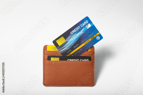Credit cards in leather wallet on white background