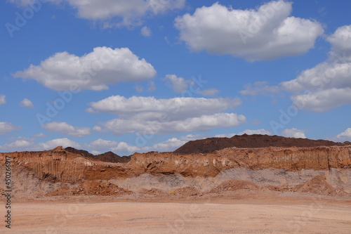 Vertical walls at the border of a gravel pit with excavator bucket marks, August 2021