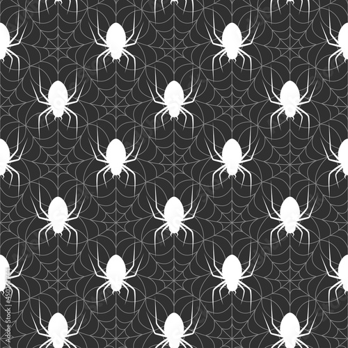 Seamless pattern with webs and spiders. Dark background in the Halloween theme. A terrifying vector illustration for printing on wrapping paper, booklets and flyers