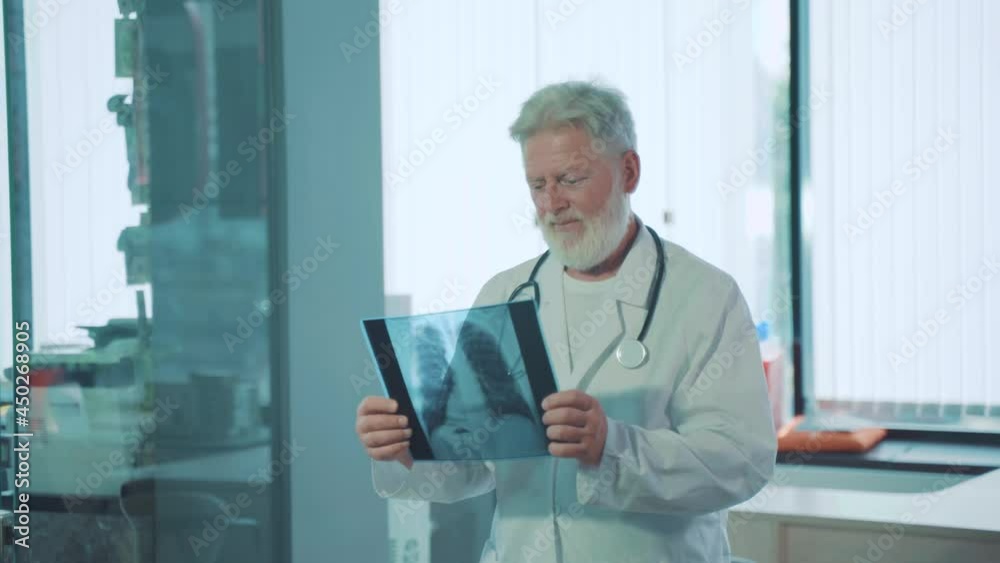 old doctor man and lung x-ray