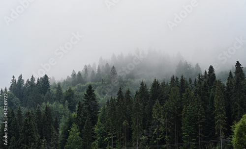 Clouds over the Ochotnica Gorna vilage hills during fogy day © Maciej Gillert