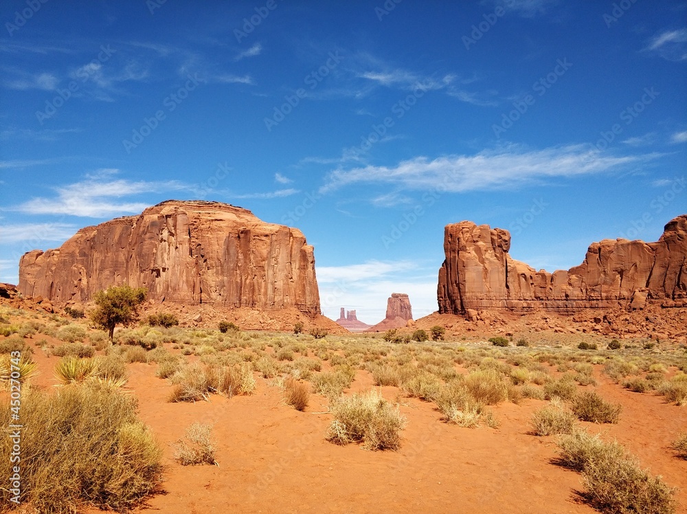 Monument Valley on a background of blue sky with clouds USA