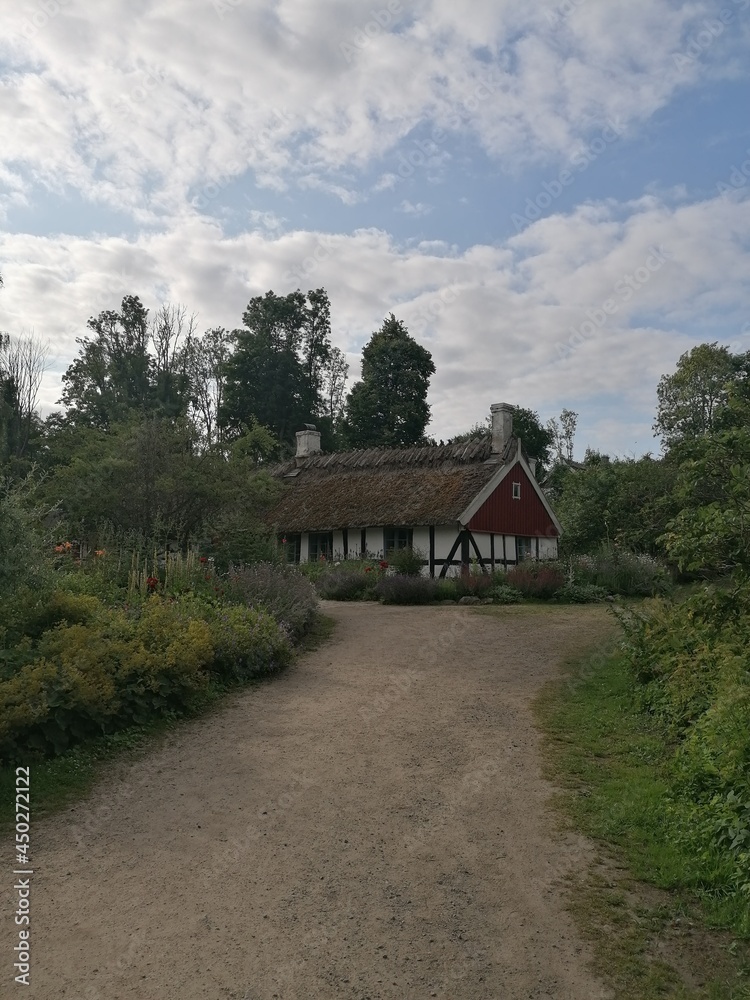 Traditional old Swedish houses with half timbering wooden constructions in nature surroundings Traditional old Swedish houses with half timbering wooden constructions in nature surroundings