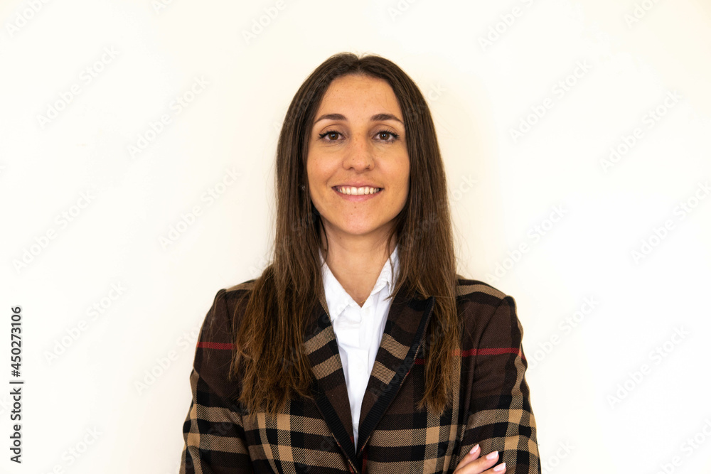 Photo of a young and attractive woman looking corporative with a shirt smiling at the camera, looking professional and ready to do bussiness with a white background