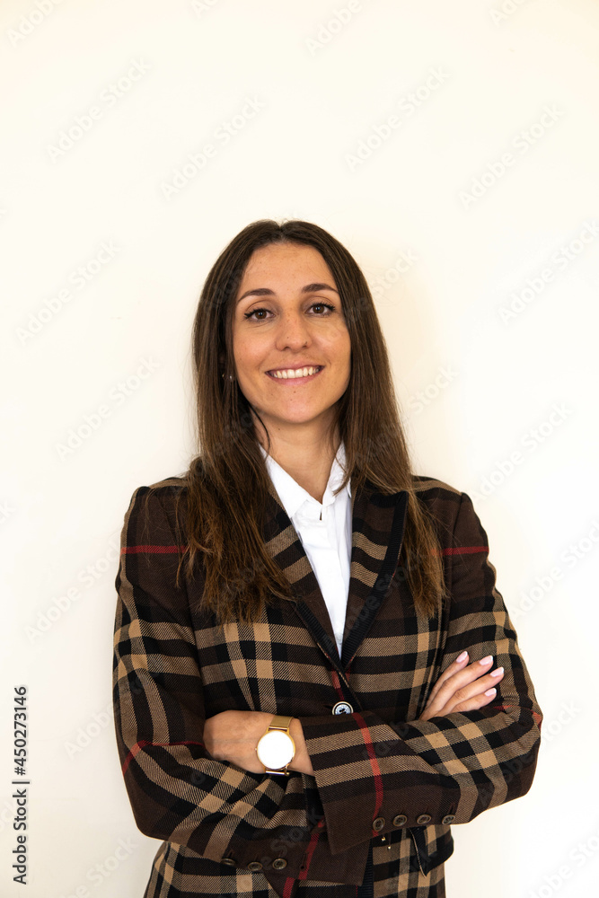 Photo of a young and attractive woman looking corporative with a shirt smiling at the camera, looking professional and ready to do bussiness with a white background