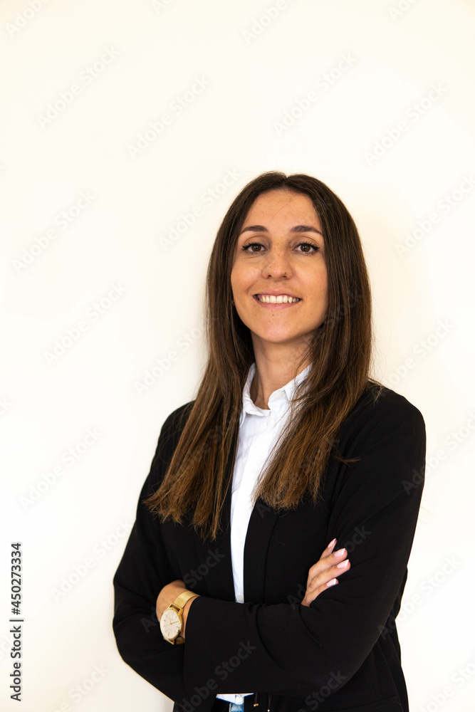 Photo of a young and attractive woman looking corporative with a shirt smiling at the camera, looking professional and ready to do bussiness with a white background