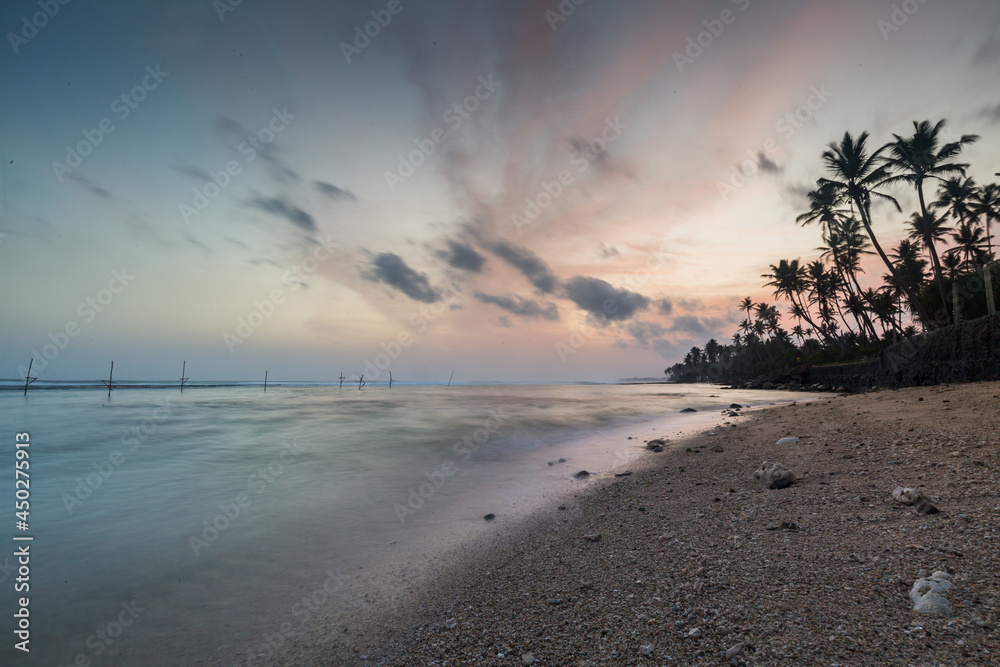 beautiful sunrise on a beach in a tropical island