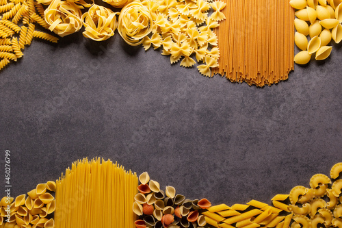 Pasta collection food on table background. Raw pasta assortment at tabletop