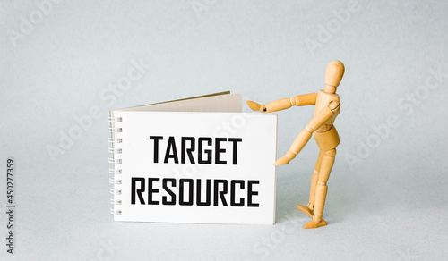 Wallpaper Mural Target resource - text on a white notepad near a wooden human doll on a blue background. Torontodigital.ca