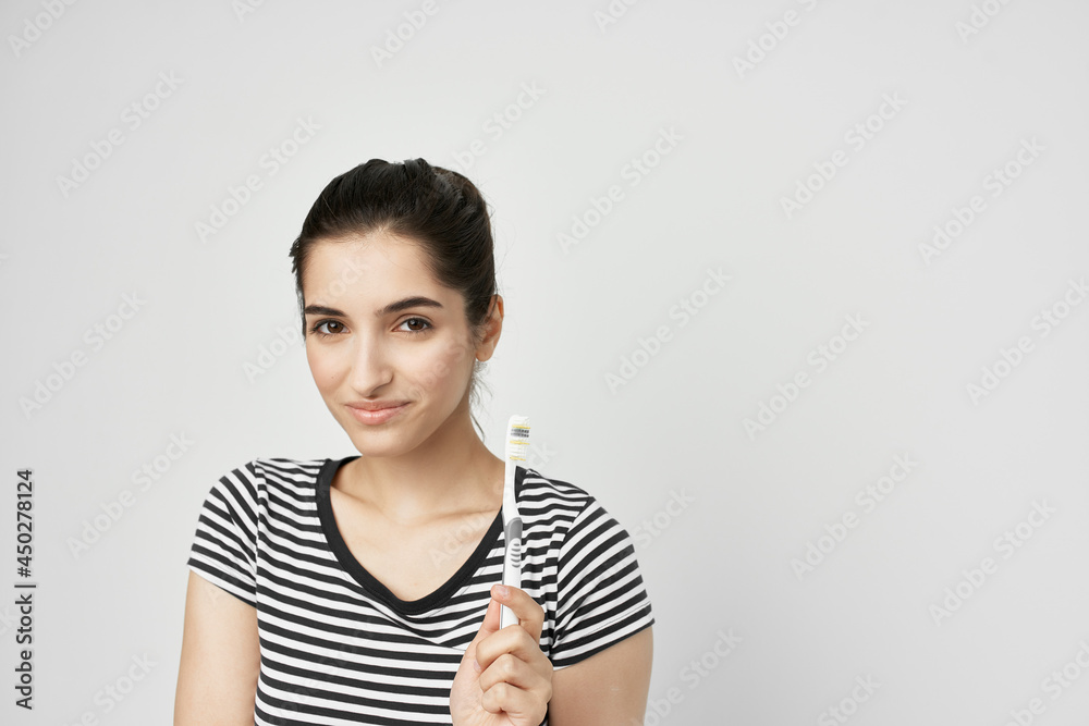 woman in striped t-shirt toothbrush oral care hygiene woman in striped t-shirt toothbrush oral care hygiene