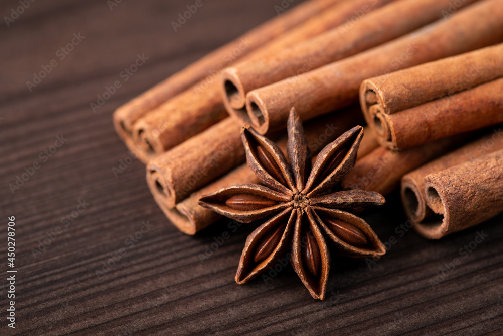 Cinnamon sticks and anice star. Spices for seasoning food on the wooden table Cinnamon sticks and anice star. Spices for seasoning food on the wooden table