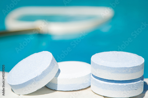 chlorine tablets for maintenance and cleaning of swimming pool water photo