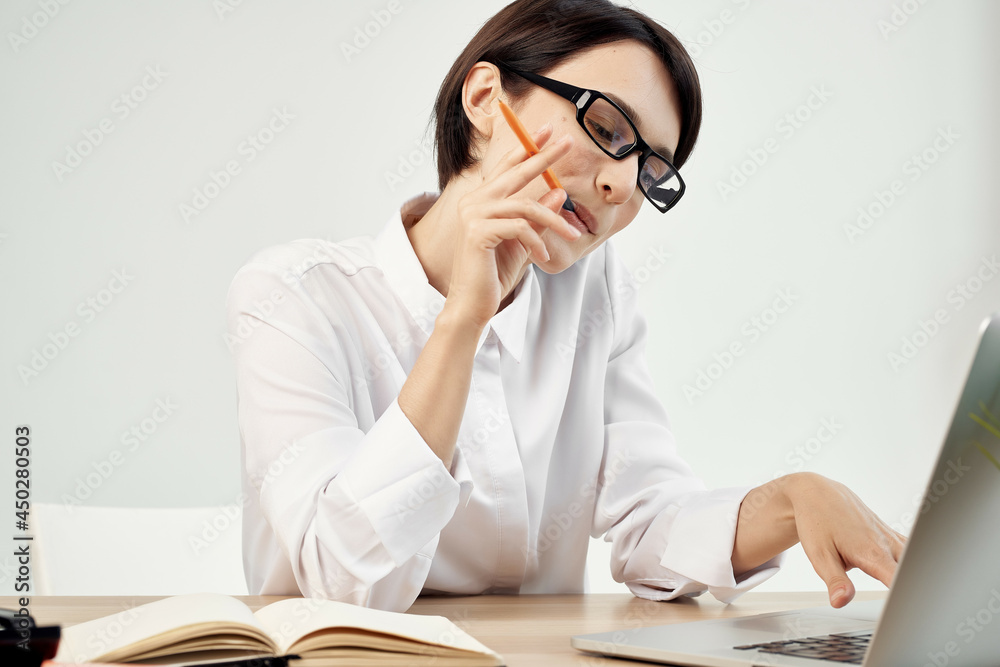 woman in costume in front of laptop documents Professional Job isolated background woman in costume in front of laptop documents Professional Job isolated background