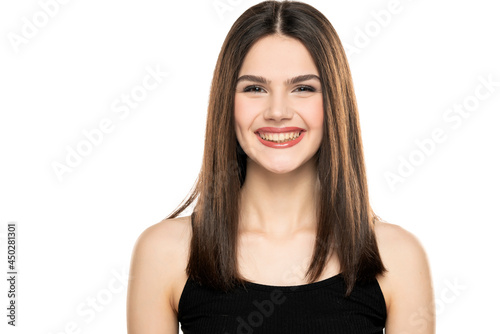 portrait of a happy teen girl with long straight hair