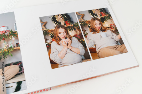 pages of photobook from photo shoot pregnancy on New Year's Day
