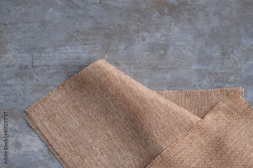 Obraz na plátně Background of sackcloth laid on a polished cement surface.