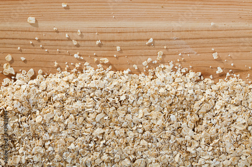 Cereals and healthy eating concept - oatmeal flakes. Natural background photo