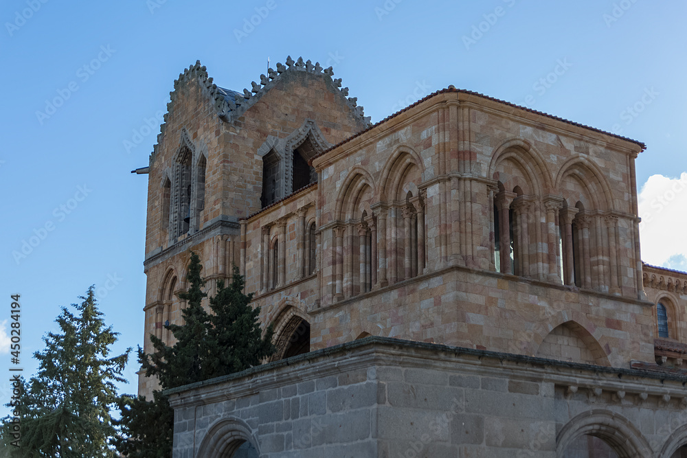 Detailed view of San Vicente Cathedral, Basílica de San Vicente, Ávila medieval historic fortress as background