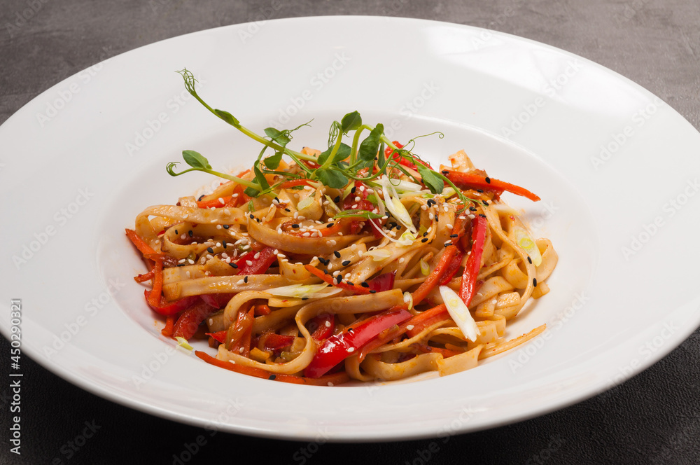 udon wheat noodles with vegetables sesame seeds and microgreens udon wheat noodles with vegetables sesame seeds and microgreens