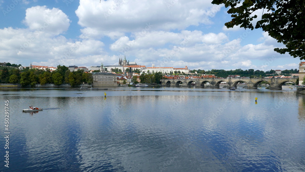 picturesque view of the Vltava River, Charles Bridge and Prague