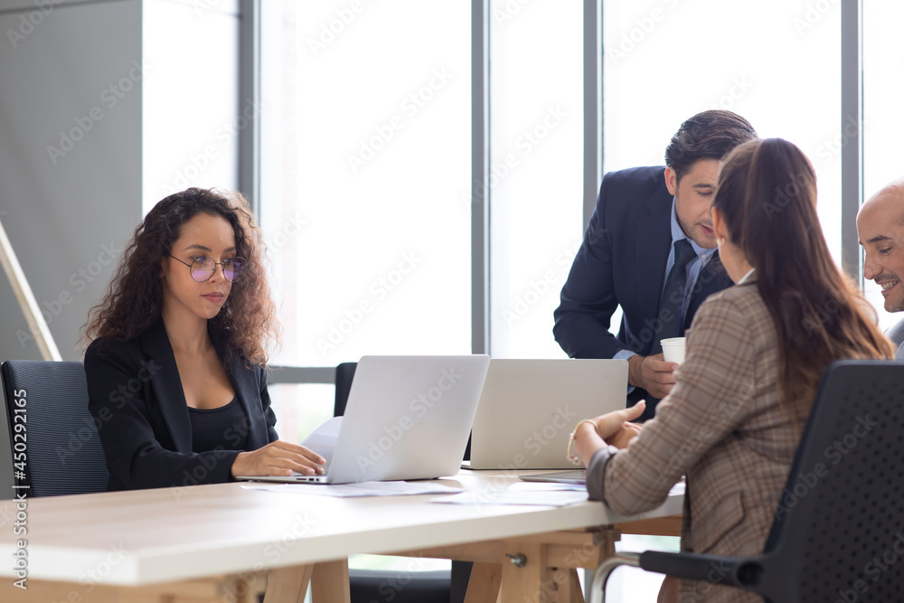 Attractive woman working on laptop computer in home office. Attractive woman working on laptop computer in home office.